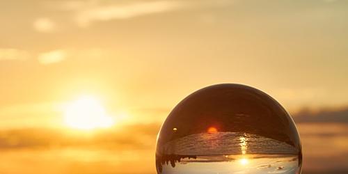 crystal ball with a sunset in the background